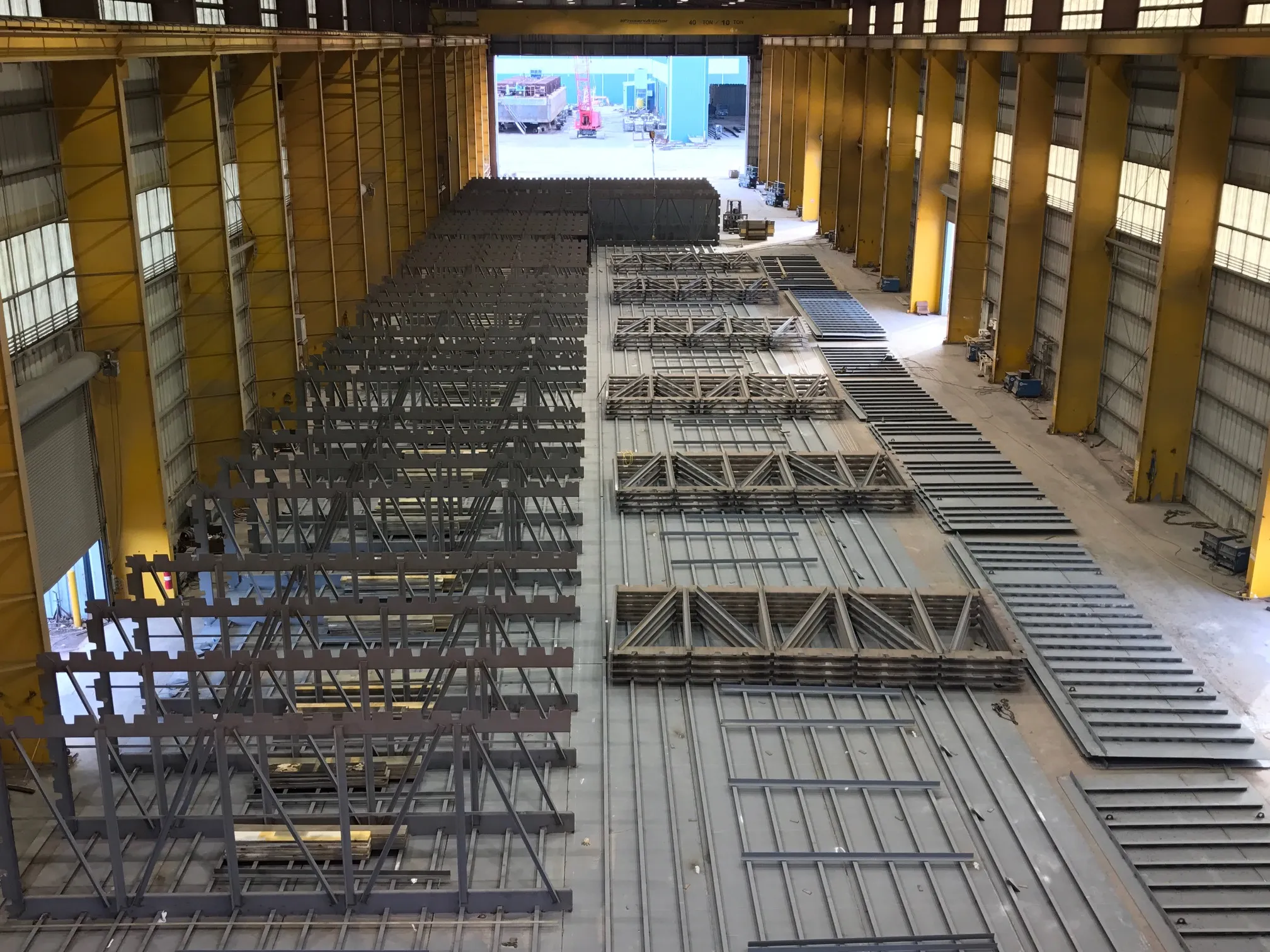 Indoor construction bay with overhead cranes at C&C Marine