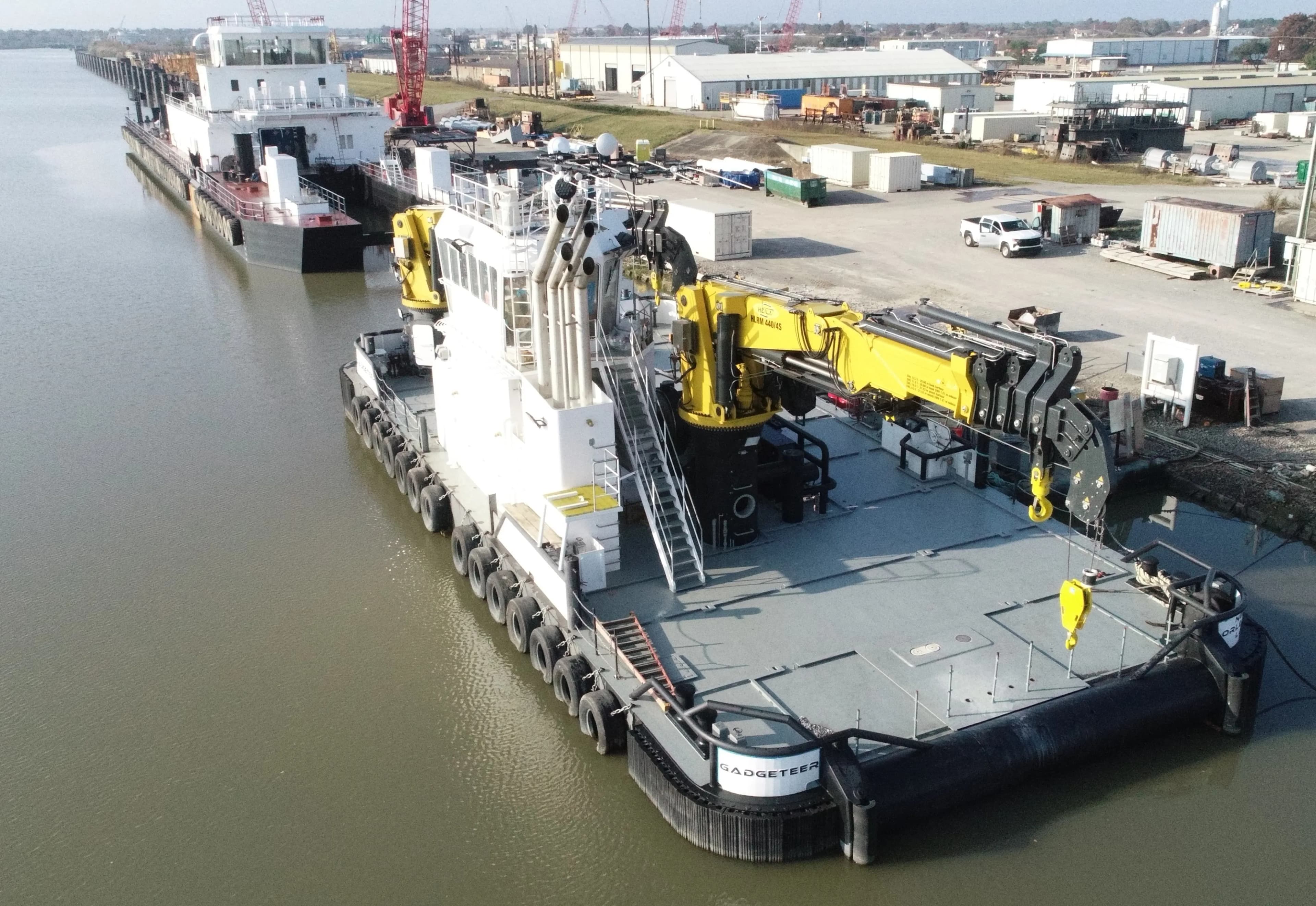 C&C Marine multicat specialty vessel with crane at dock